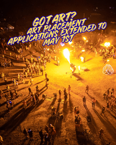 A nighttime festival scene with people gathered around fire art installations. Bold text reads: “Got Art? Art Placement Applications Extended to May 1st.”.